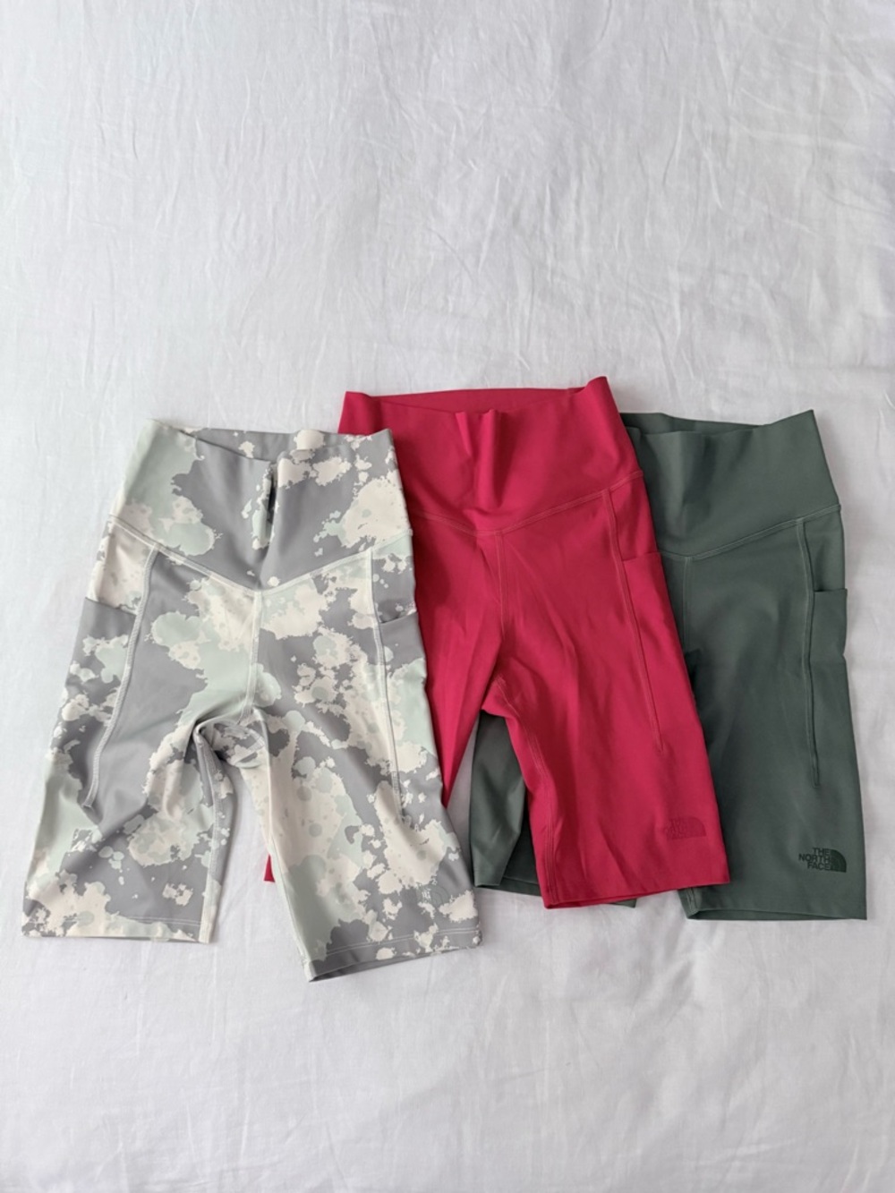 The North Face Kids' Bike Shorts Trio — Pink, Olive, and Light Camo